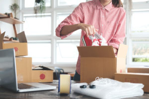 Business Start up SME concept. Young self-employed startup entrepreneur small business owner working at home, packaging and delivery situation.