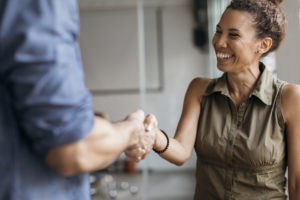 Welcoming a new employee with a handshake
