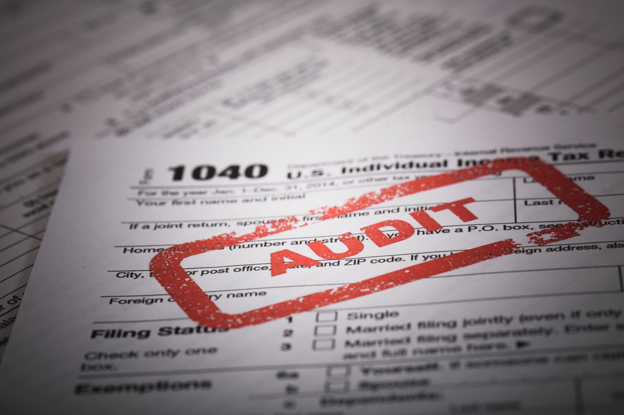 Red Audit stamp on a 1040 US individual income tax return. Photographed at 50mp with the Canon EOS 5DSR and the 100mm 2.8 L lens.