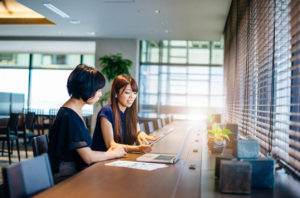 two women working on the 2020 business budget