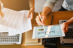 CPA looking over small business's accounting records