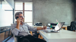 businessman on the phone in the office of his limited liability corporation