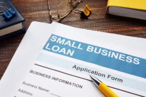 Small business loans concept - Business loan application form placed on a table with a pen.